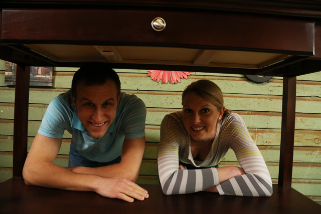 Brandon and Chelsea Under Table Before Bed Bench