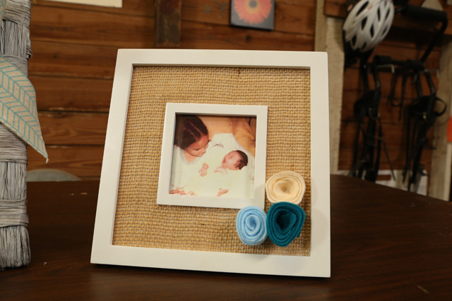 white picture frame with burlap and blue felt flowers