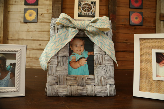 white washed woven frame with ribbon bow on top