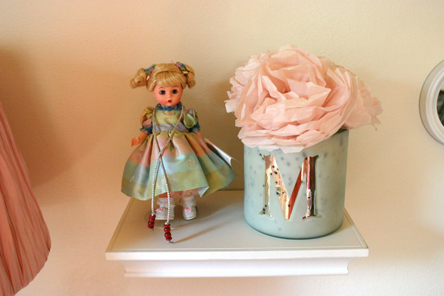 jumping rope madame alexander doll on floating shelf with tissue paper pink flowers