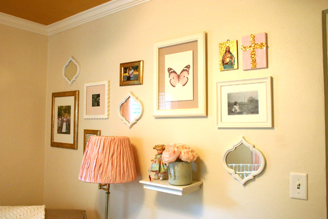 pink, gold and white gallery wall frames and shelf