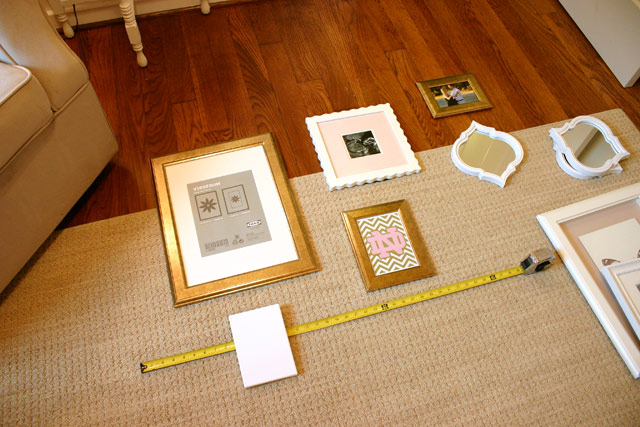 tape measure picture frames on floor for gallery wall hanging