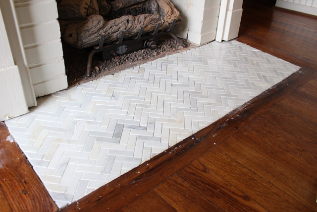 Tips on removing hardy quarry tiles from a fireplace hearth and an EASY way to flush tiles with existing flooring. Fireplace hearth makeover complete!