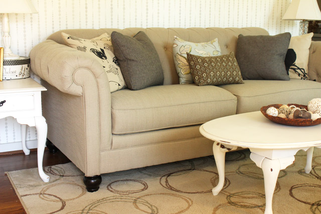 tan tufted sofa in living room