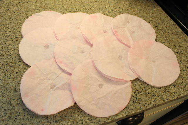 pink dyed coffee filters glued together on counter