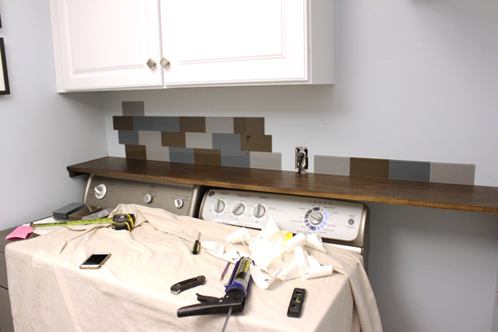 Progress on Backsplash Tile Above Washer and Dryer