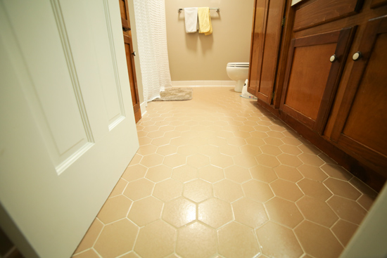 Tan Hexagon Tiles on Floor of Bathroom