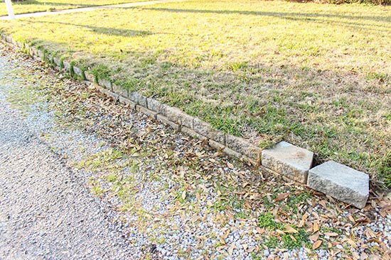 Overgrown Retaining Wall in Front Yard