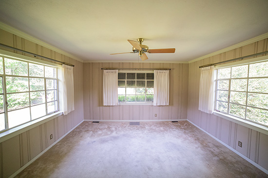 Painted Paneling Room with Large Windows and Drapes