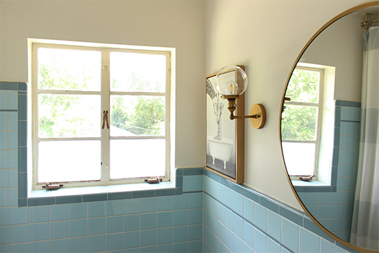 Brass Mirror and Sconces with Casement Windows