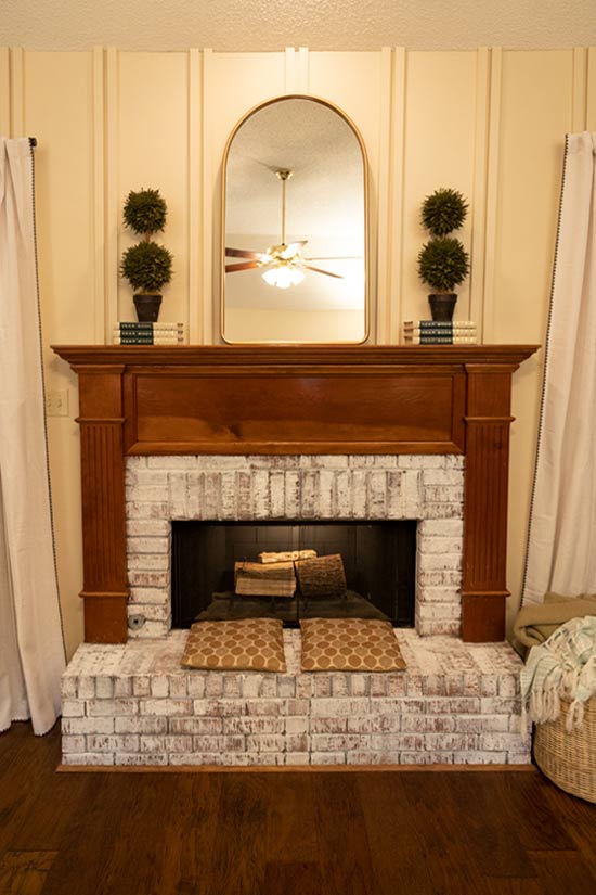 Vertical Battens Over Fireplace Make Room Feel Larger