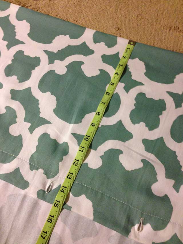 Tape measure at 15 inches on blue curtain