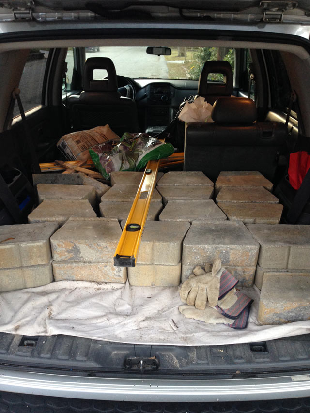 Pavestone retaining wall blocks in back of SUV