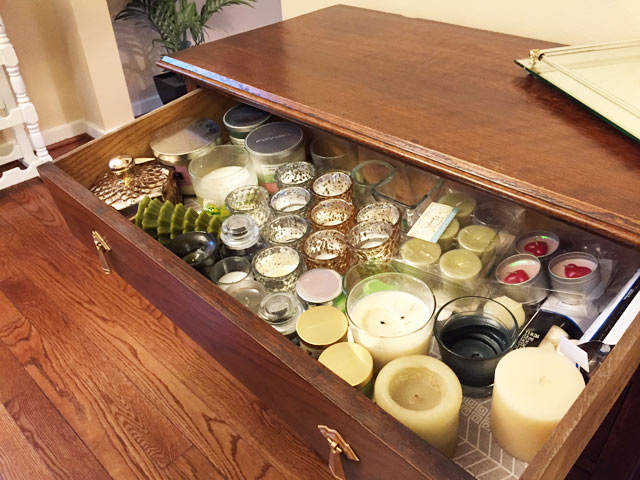 candles votive holders in open top dresser drawer