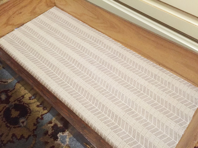 new fabric in place as liner in bottom of wood dresser drawer