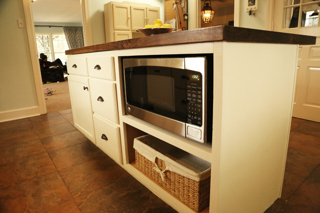 microwave on shelf in kitchen island