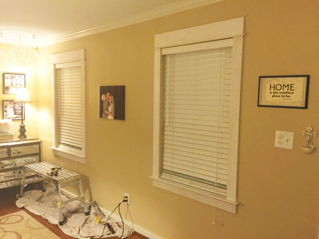 yellow tan walls with fresh installed window trim before painting