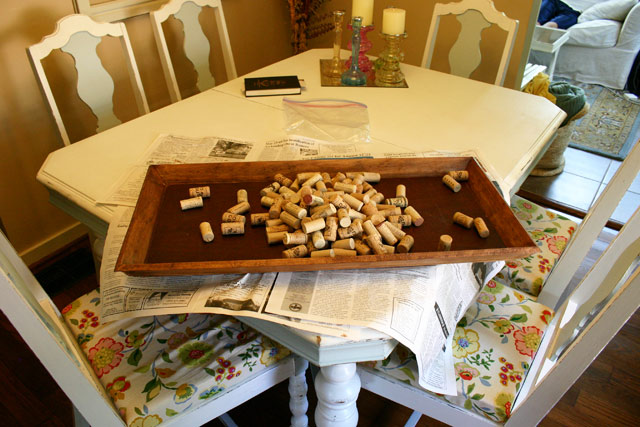 wine corks boot tray shoe tray stained wood on white dining table