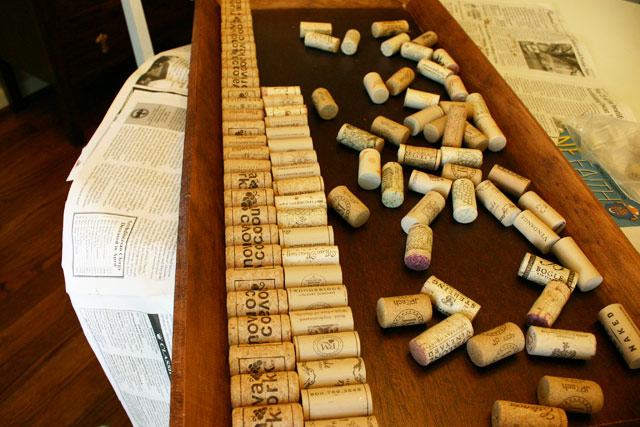 wine corks lined up on shoe tray