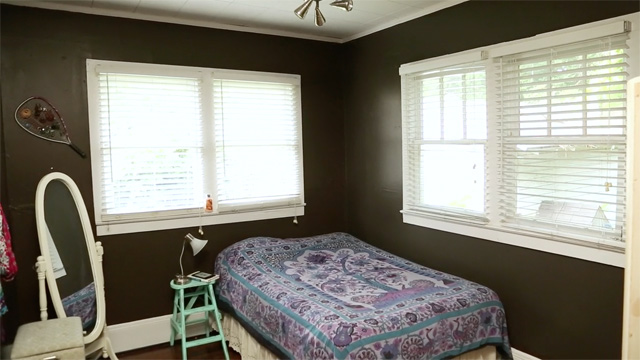 brown bedroom walls with single-pane windows