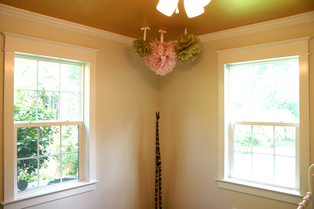 white paint, gold ceiling, tissue pom pom, window trim