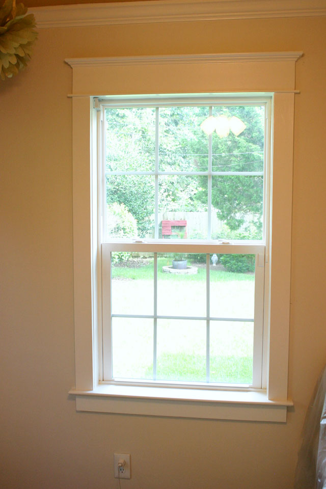 craftsman white window trim with putty, caulk, and paint