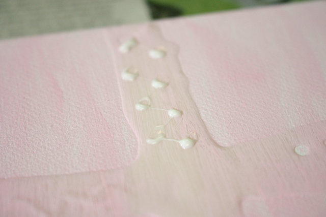 Dots of Glue Along Cross on Canvas