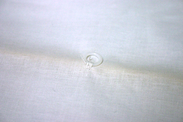 plastic drapery ring on roman shade
