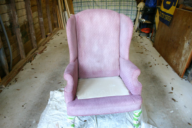 maroon armchair with 3 coats of white paint