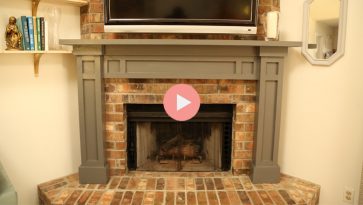 gray fireplace mantel over brick fireplace hearth