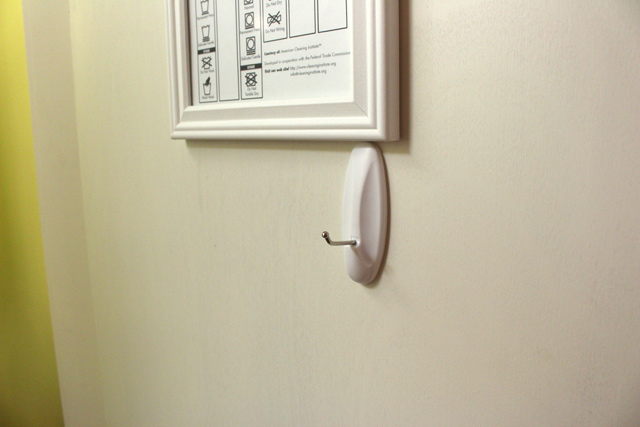 white 3m command hook hanging on white hollow core door 