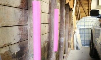 pink pool noodles attached to garage studs to protect car door