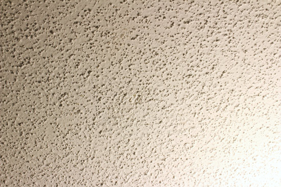 Hole in Ceiling Covered with Popcorn Texture