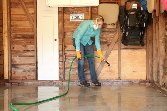 Rinsing Concrete Cleaner From Garage Floor