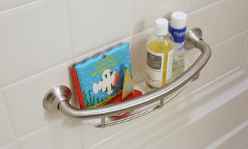 Bath Safety Month Grab Bar Install with Baby Toys and Shampoo