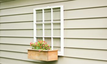 Upcycle wood window into Backyard Decor on tan vinyl garage wall