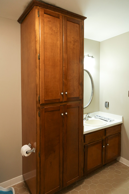 Tall Wood Cabinet Makes Bathroom Feel Cramped