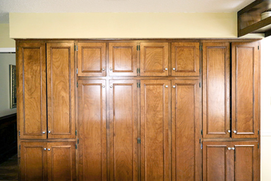 Oak Stained Wall of Kitchen Cabinets Before Painting