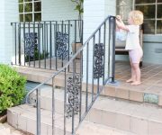 Baby Toddler Helping Paint Iron Handrails on 1950s Ranch Home