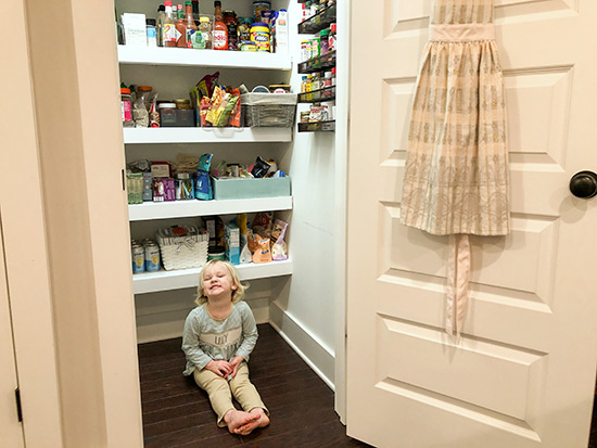 Lucy Sitting in Finished Pantry
