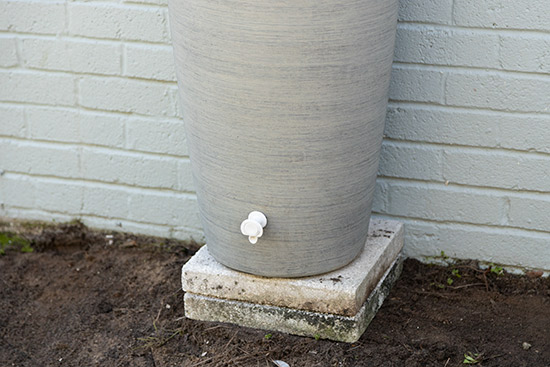 Prop Rain Barrel to Maximize Refill Container