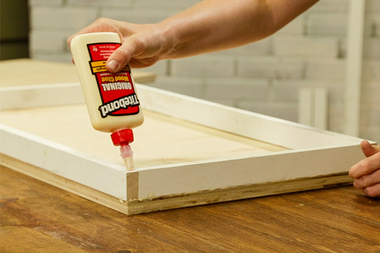 Applying Titebond Wood Glue to Hold Table Leg Together