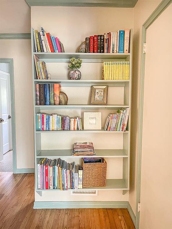 DIY Bookshelf Hanging in White Hallway